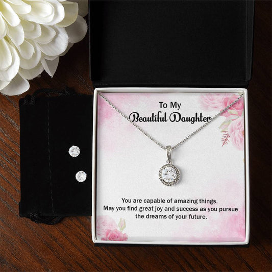 pink message card with flowers and white gold circle pendant with earrings in a black box